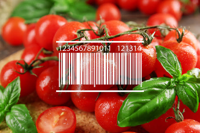 Fresh cherry tomatoes on a vine with basil leaves; a white barcode overlay sits across the center.